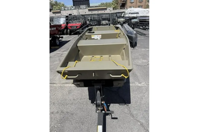 The Image of 2026 Tracker Grizzly 12 Jon boat on trailer, displayed outdoors. - 0