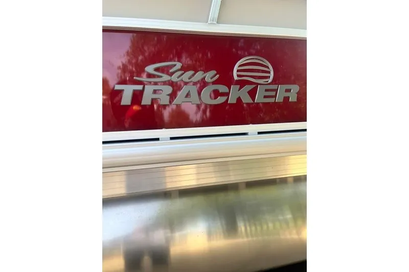 Slide: The Image of Sun Tracker Bass Buggy 16 XL Select 2026 logo on red background. - 9