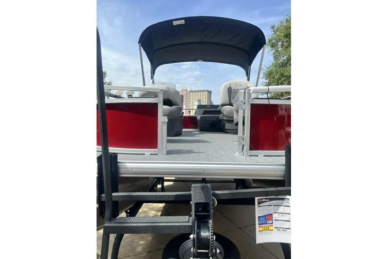 Slide: The Image of 2026 Sun Tracker Bass Buggy 16 XL Select pontoon boat with canopy, viewed from the rear. - 10
