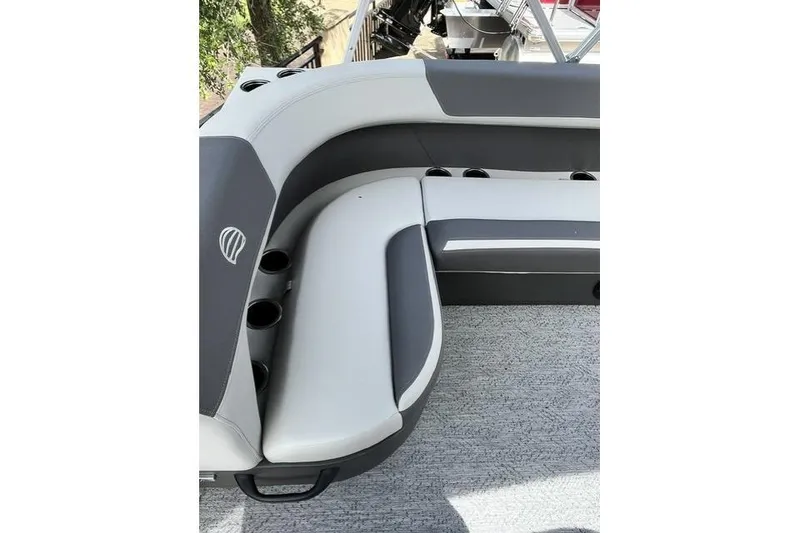 Slide: The Image of 2026 Sun Tracker Bass Buggy 16 XL Select boat seating area with cup holders. - 2