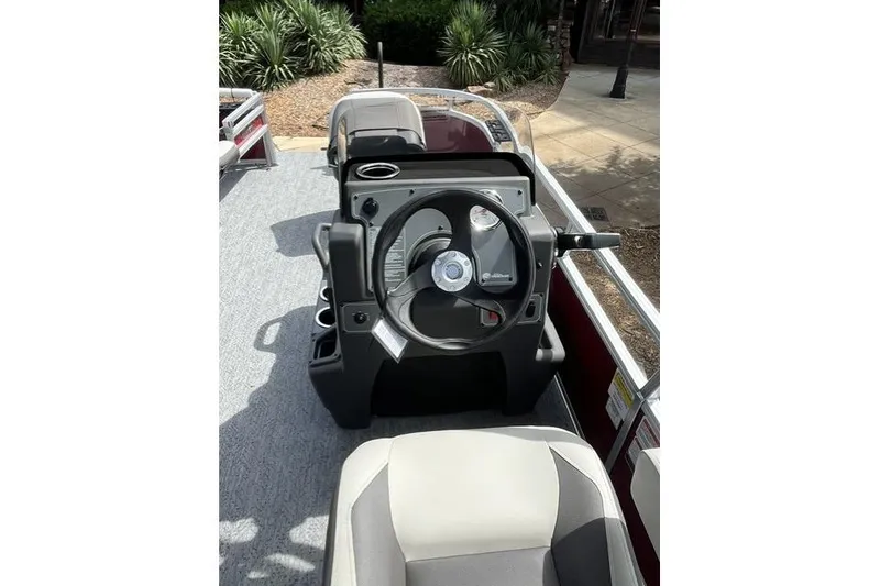 Slide: The Image of 2026 Sun Tracker Bass Buggy 16 XL Select steering console with modern design and controls. - 5