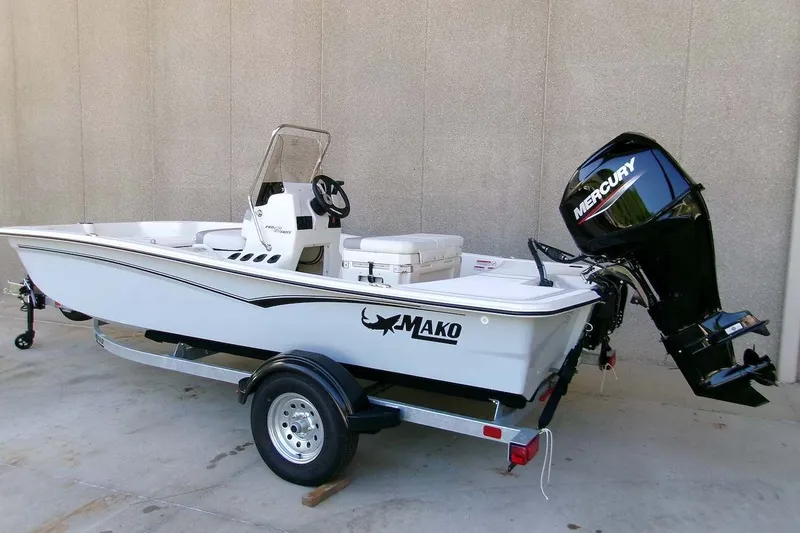 Slide: The Image of 2026 Mako Pro Skiff 15 CC boat with Mercury outboard motor on trailer. - 3