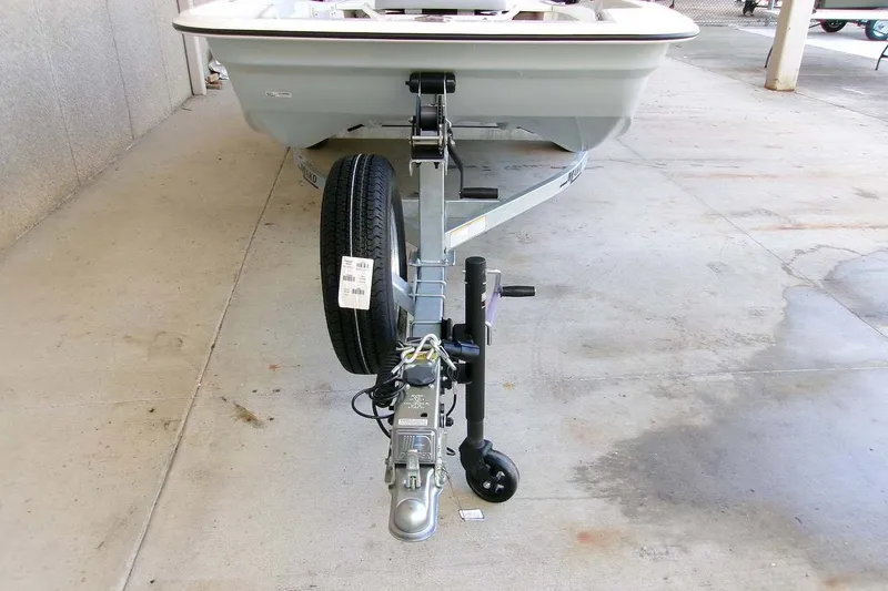 Slide: The Image of 2026 Mako Pro Skiff 15 CC boat on trailer, viewed from the front. - 8