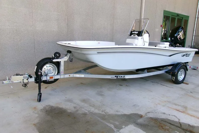 Slide: The Image of 2026 Mako Pro Skiff 15 CC boat on trailer, parked outdoors. - 6