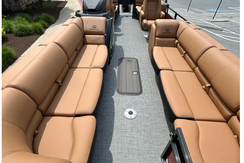 Slide: The Image of Luxurious interior of 2026 Regency 250 DL pontoon boat with tan seating. - 4