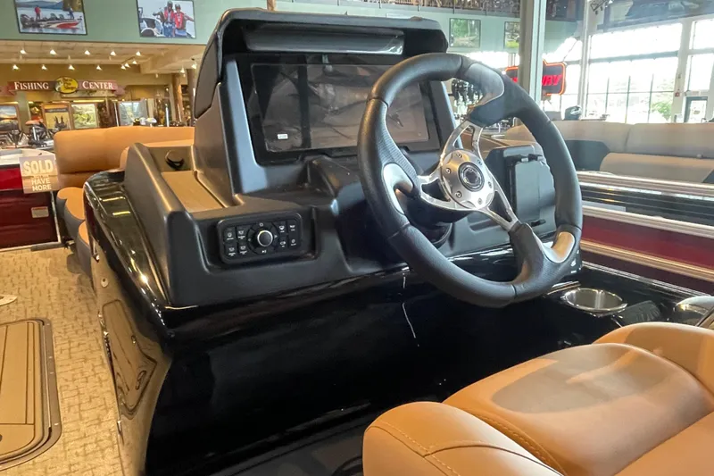 Slide: The Image of Interior view of 2026 Regency 250 DL boat with steering wheel and control panel. - 6