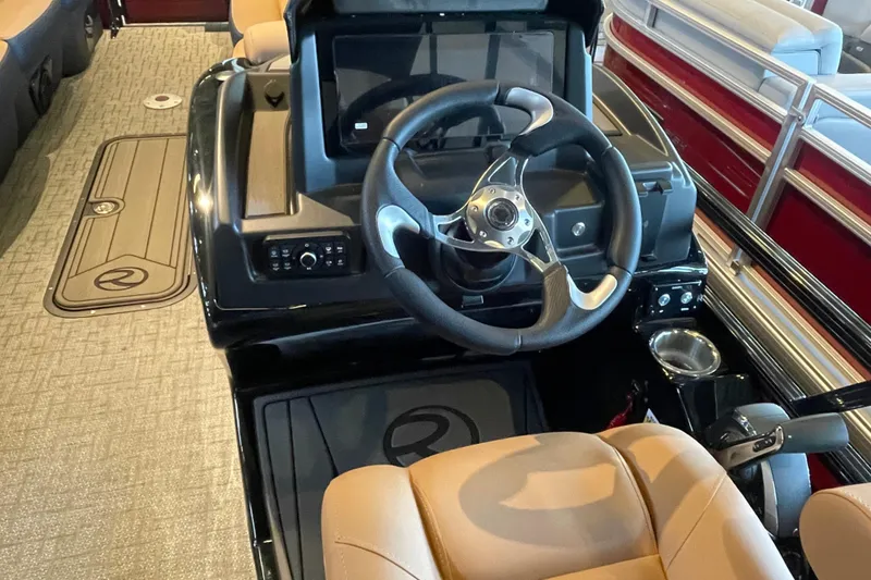 Slide: The Image of 2026 Regency 250 DL boat interior with steering wheel and dashboard controls. - 7