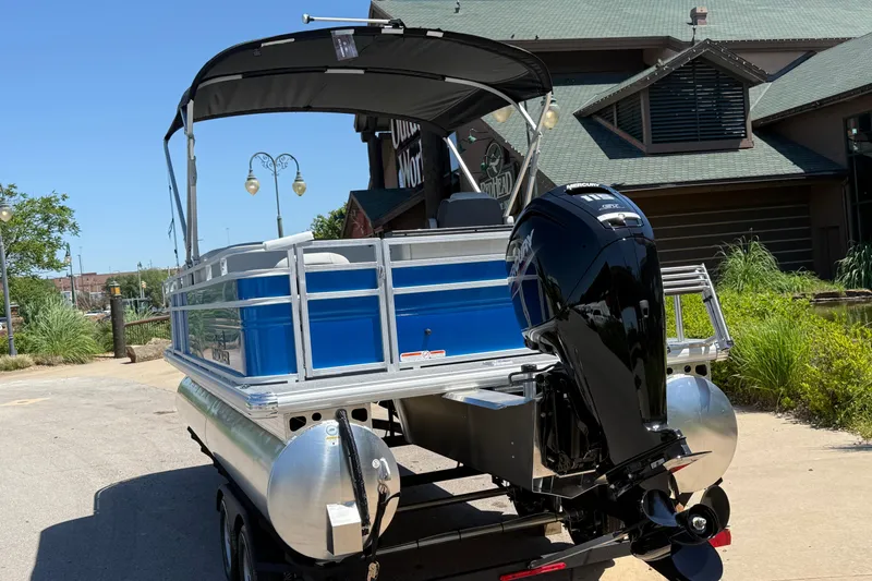 Slide: The Image of 2026 Sun Tracker Fishin' Barge 20 DLX pontoon boat with Mercury outboard motor. - 3