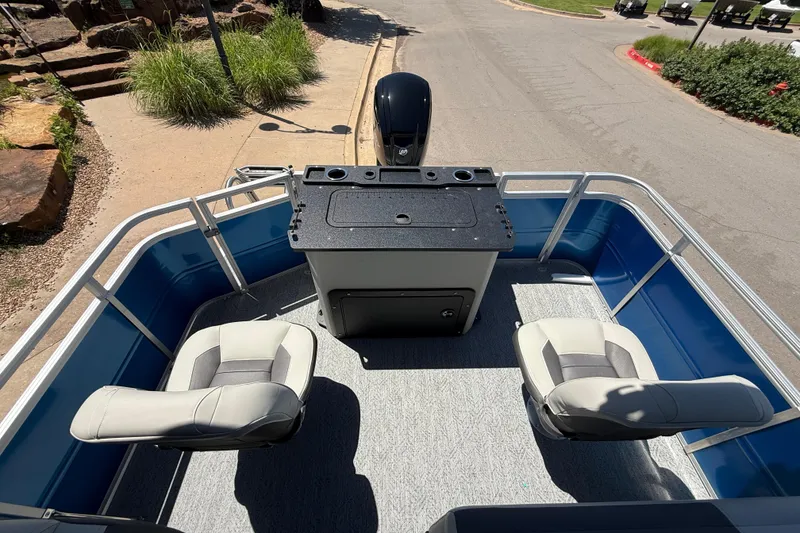 Slide: The Image of 2026 Sun Tracker Fishin' Barge 20 DLX interior with seating and control console. - 7