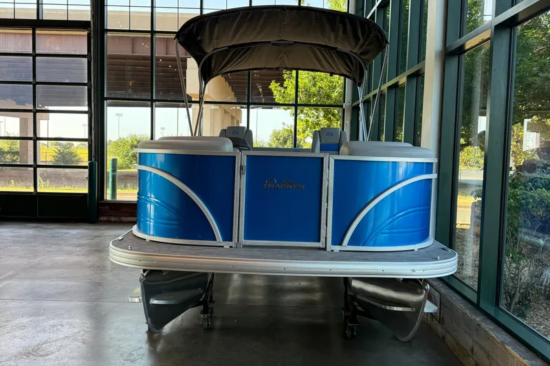 Slide: The Image of 2026 Sun Tracker Party Barge 22 RF DLX pontoon boat displayed indoors. - 94