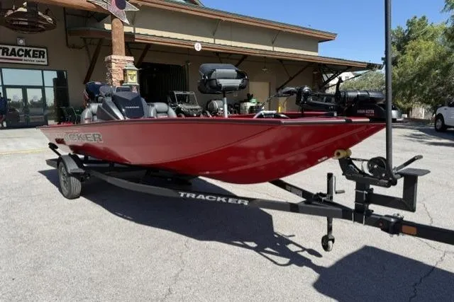 The Image of 2026 Tracker Pro Team 190 boat in red on a trailer, parked outdoors. - 0
