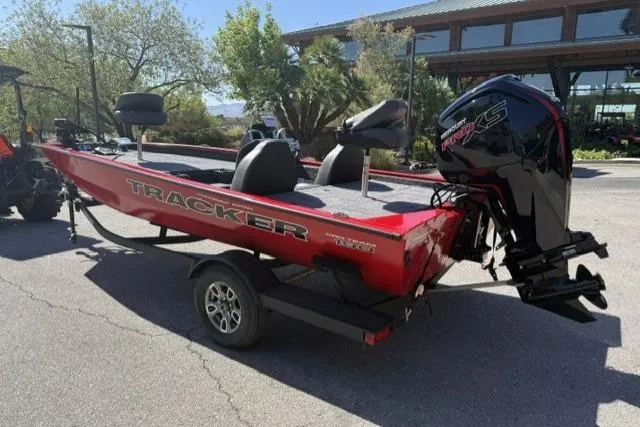 Slide: The Image of 2026 Tracker Pro Team 190 boat on trailer, red exterior, parked outdoors. - 2