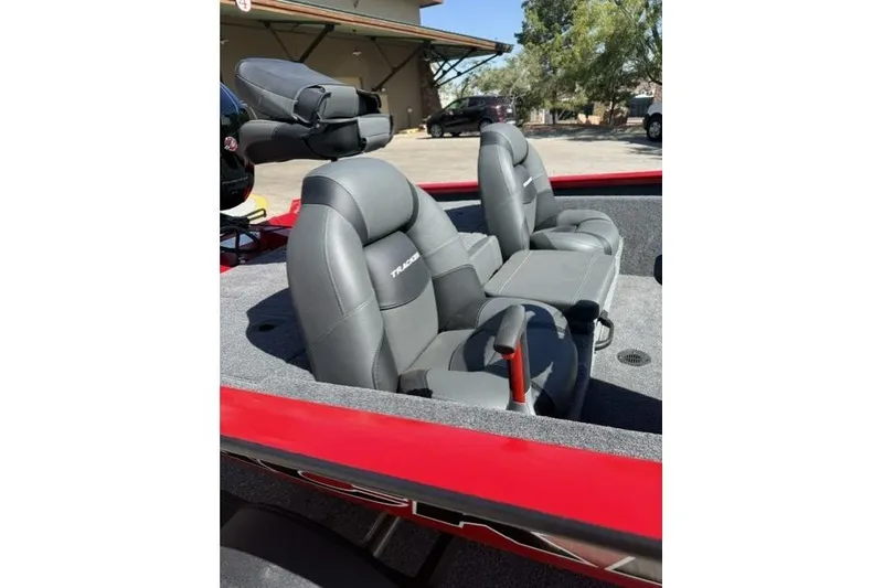 Slide: The Image of 2026 Tracker Pro Team 190 boat interior with gray seats and red trim. - 6