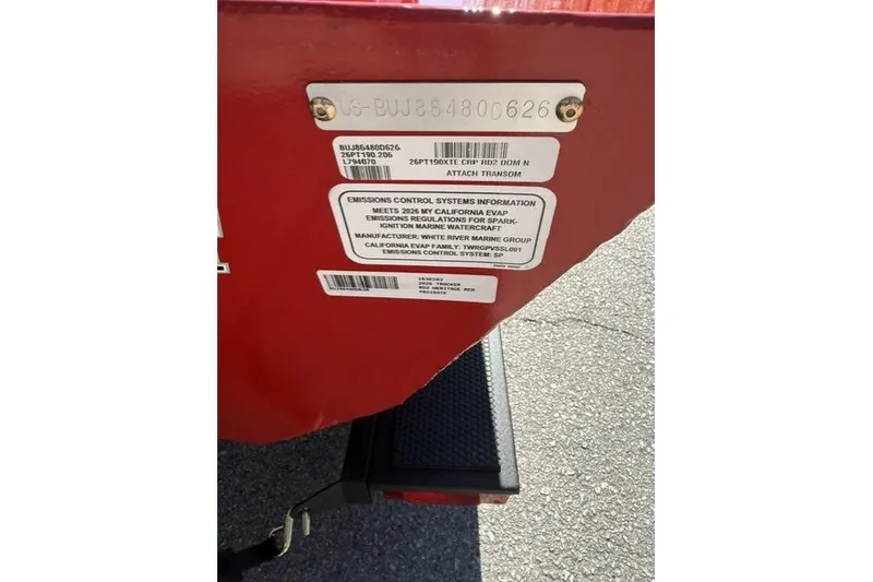 Slide: The Image of 2026 Tracker Pro Team 190 boat transom with emissions control information labels. - 9