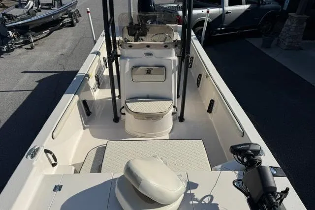Slide: The Image of 2022 Carolina Skiff 23 LS boat interior with seating and steering console. - 6