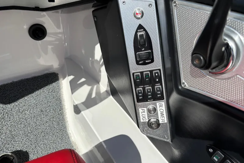 Slide: The Image of Control panel of a 2012 MasterCraft X-15 boat with various switches and buttons. - 5