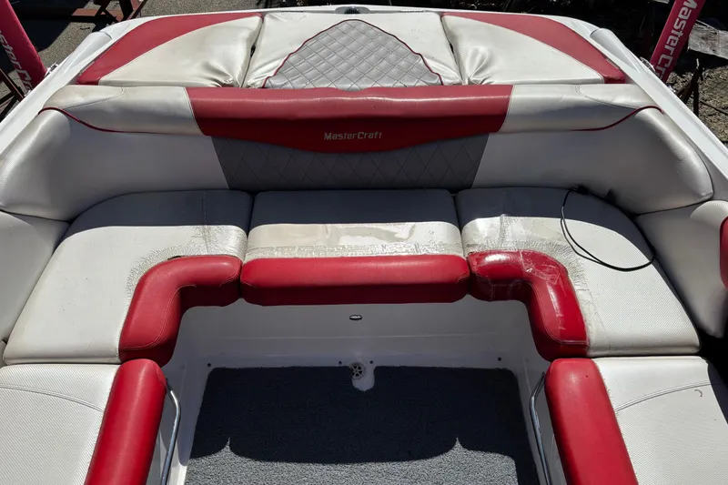 Slide: The Image of 2012 MasterCraft X-15 boat interior with red and white seating. - 9