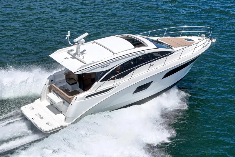 Slide: The Image of 2017 Sea Ray Sundancer 400 cruising on open water, showcasing sleek design and performance. - 1