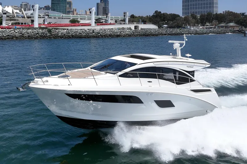 Slide: The Image of 2017 Sea Ray Sundancer 400 yacht cruising on a sunny day near the coastline. - 11
