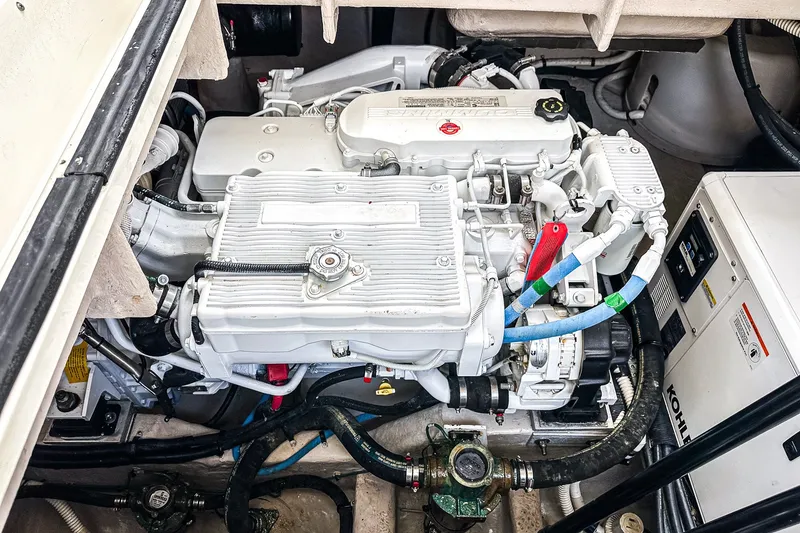 Slide: The Image of Engine compartment of a 2017 Sea Ray Sundancer 400 boat, featuring a clean, organized layout. - 39