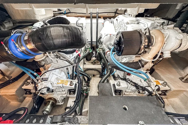 Slide: The Image of Engine room of 2017 Sea Ray Sundancer 400, showcasing dual engines and mechanical components. - 42