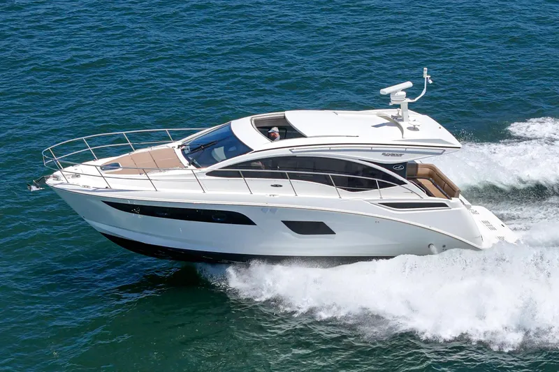 Slide: The Image of 2017 Sea Ray Sundancer 400 cruising on open water, showcasing sleek design and luxury features. - 18
