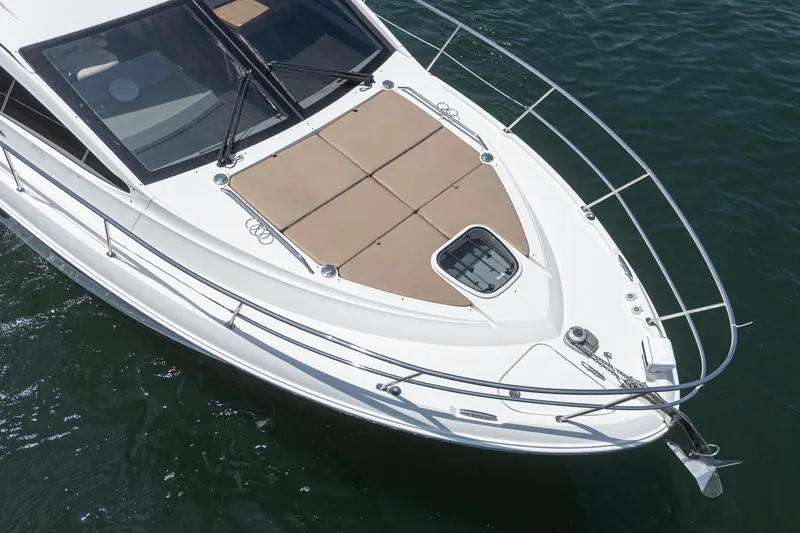 Slide: The Image of 2017 Sea Ray Sundancer 400 yacht, aerial view of bow with sunpad and railing. - 24