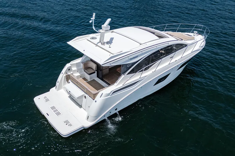 Slide: The Image of 2017 Sea Ray Sundancer 400 yacht cruising on open water. - 26