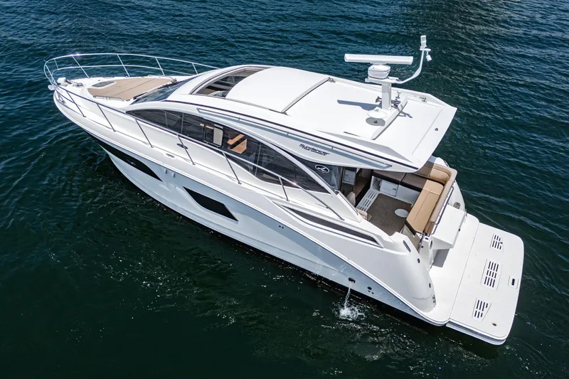 Slide: The Image of 2017 Sea Ray Sundancer 400 yacht cruising on open water. - 28