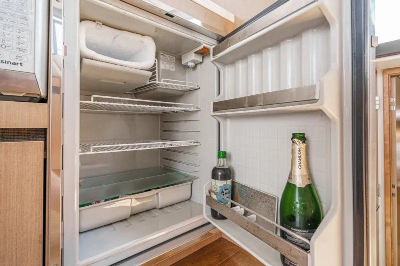 Slide: The Image of Open refrigerator on 2017 Sea Ray Sundancer 400 yacht, containing beverages. - 19