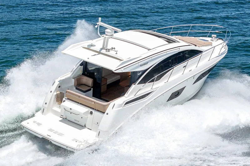 Slide: The Image of 2017 Sea Ray Sundancer 400 cruising on open water, showcasing sleek design and powerful performance. - 58
