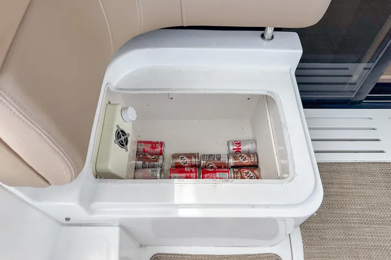 Slide: The Image of Built-in cooler with soda cans on a 2017 Sea Ray Sundancer 400 boat. - 31