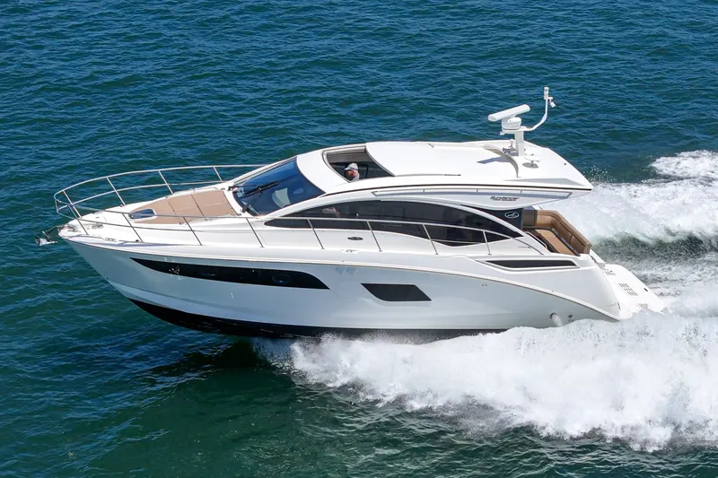 Slide: The Image of 2017 Sea Ray Sundancer 400 cruising on open water, showcasing sleek design and luxury features. - 63