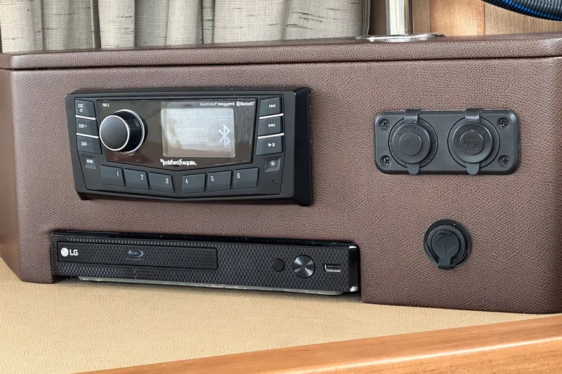 Slide: The Image of Control panel of a 2017 Sea Ray Sundancer 400 with audio and USB ports. - 17