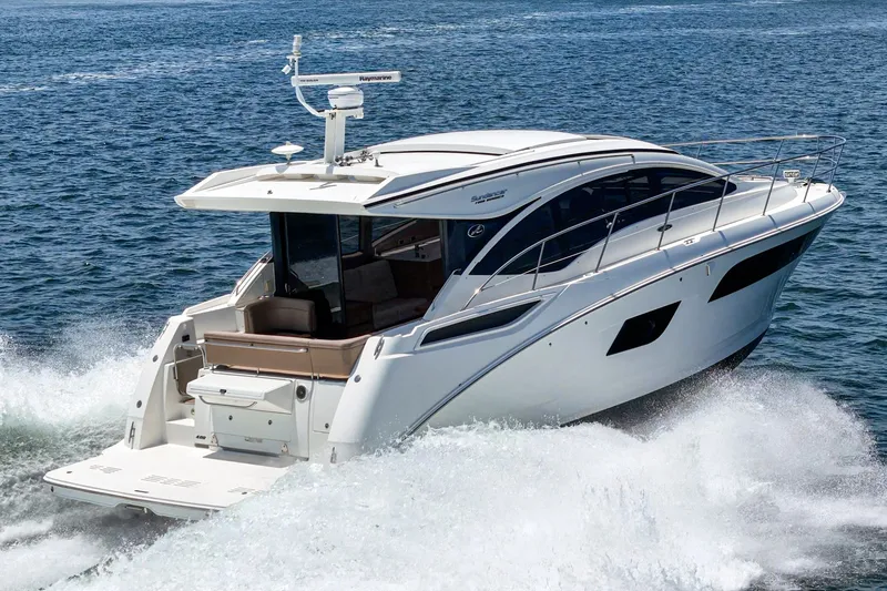 Slide: The Image of 2017 Sea Ray Sundancer 400 cruising on open water, showcasing sleek design and luxury features. - 65