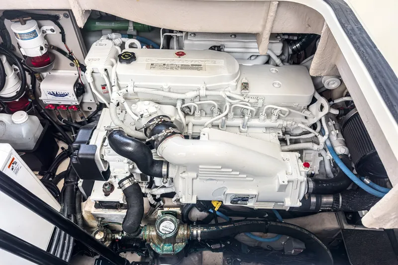 Slide: The Image of Engine compartment of a 2017 Sea Ray Sundancer 400 yacht, showcasing detailed machinery. - 38