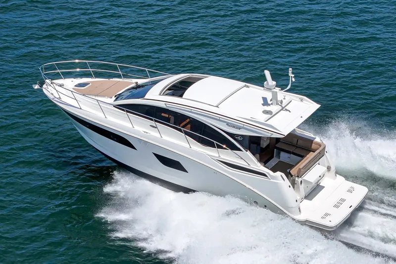 Slide: The Image of 2017 Sea Ray Sundancer 400 cruising on open water, showcasing sleek design and luxury features. - 64