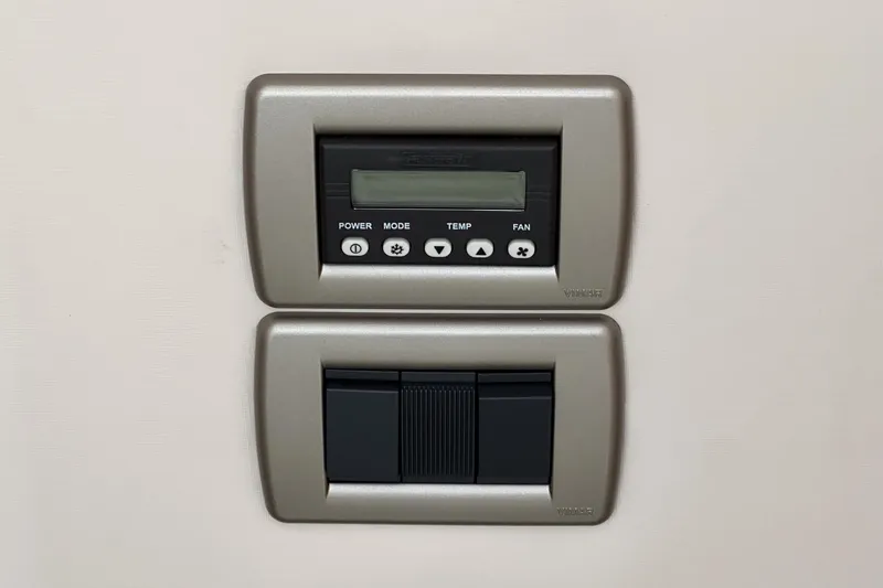 Slide: The Image of Control panel on a 2017 Sea Ray Sundancer 400 yacht, featuring buttons and display. - 44