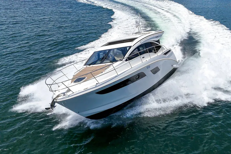 Slide: The Image of 2017 Sea Ray Sundancer 400 yacht cruising on open water, creating a dynamic wake. - 52