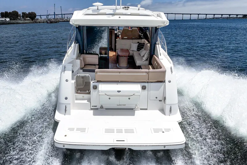 Slide: The Image of 2017 Sea Ray Sundancer 400 cruising on open water, rear view. - 5