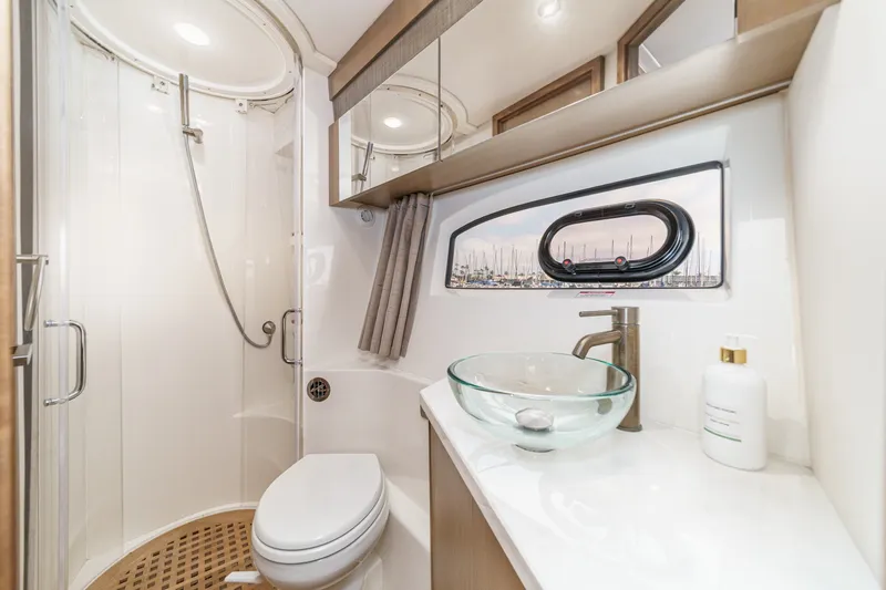 Slide: The Image of Luxurious bathroom in 2017 Sea Ray Sundancer 400 yacht with modern fixtures and glass sink. - 34