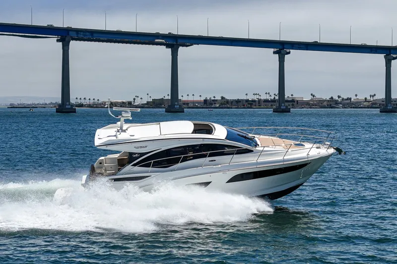 Slide: The Image of 2017 Sea Ray Sundancer 400 cruising under a bridge on a sunny day. - 62