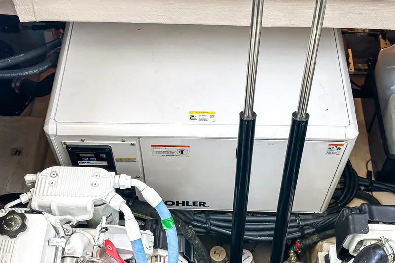 Slide: The Image of Engine compartment of 2017 Sea Ray Sundancer 400 with Kohler generator and hydraulic components. - 40