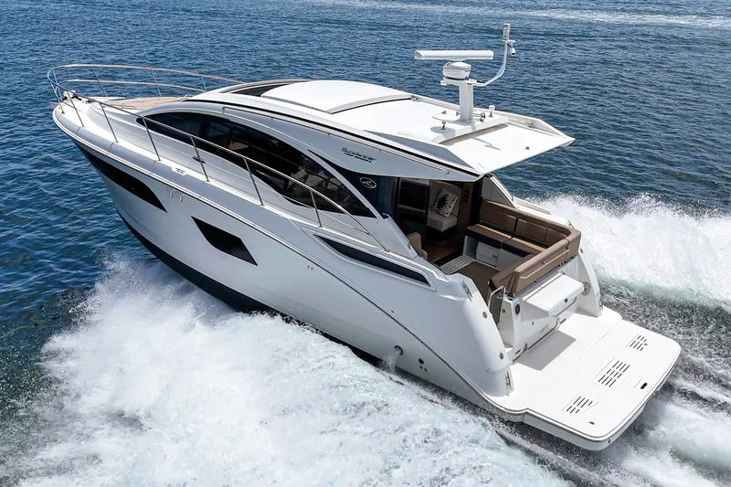 Slide: The Image of 2017 Sea Ray Sundancer 400 yacht cruising on open water, showcasing sleek design and luxury. - 47