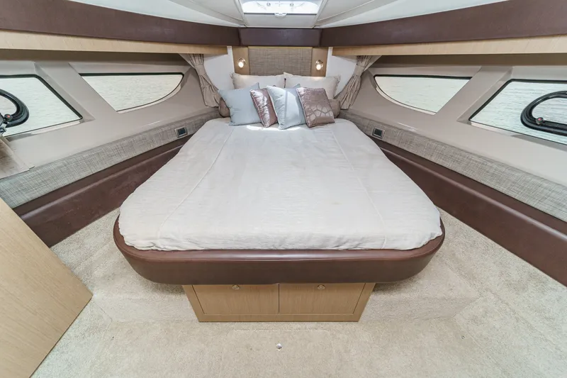 Slide: The Image of Luxurious cabin interior of 2017 Sea Ray Sundancer 400 yacht with elegant bedding. - 31