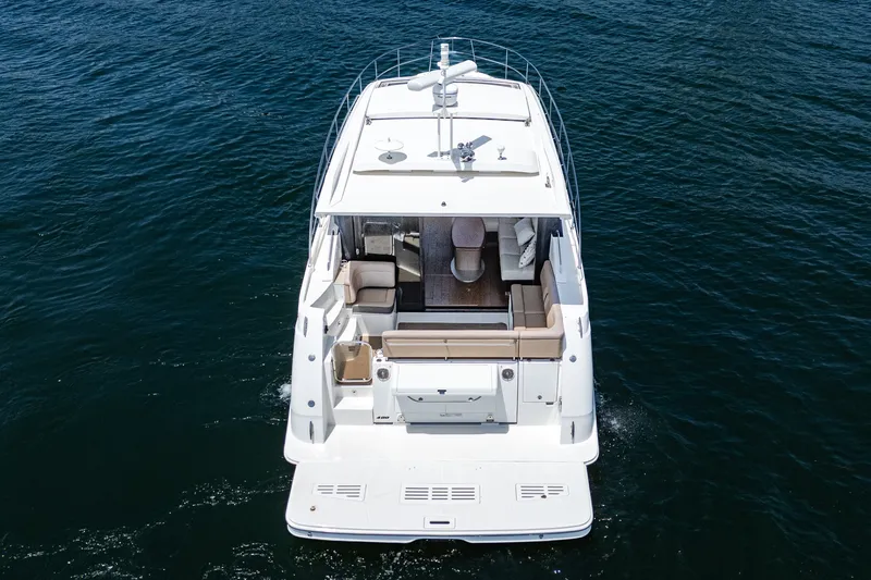Slide: The Image of 2017 Sea Ray Sundancer 400 yacht cruising on open water, aerial view. - 72