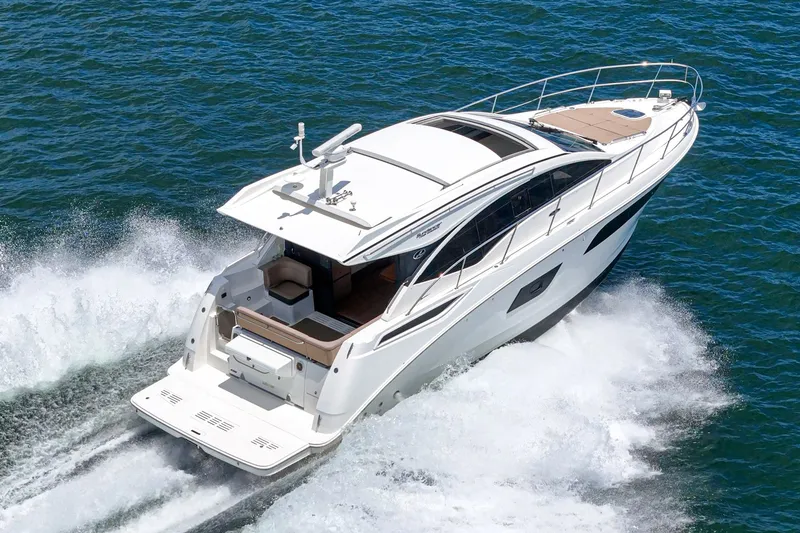 Slide: The Image of 2017 Sea Ray Sundancer 400 cruising on open water, showcasing sleek design and performance. - 60