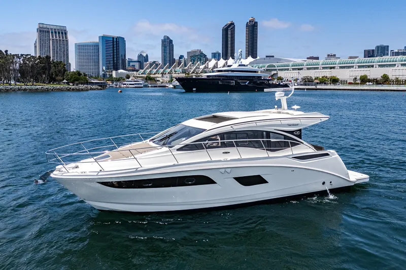 Slide: The Image of 2017 Sea Ray Sundancer 400 yacht cruising in urban waterfront setting. - 66