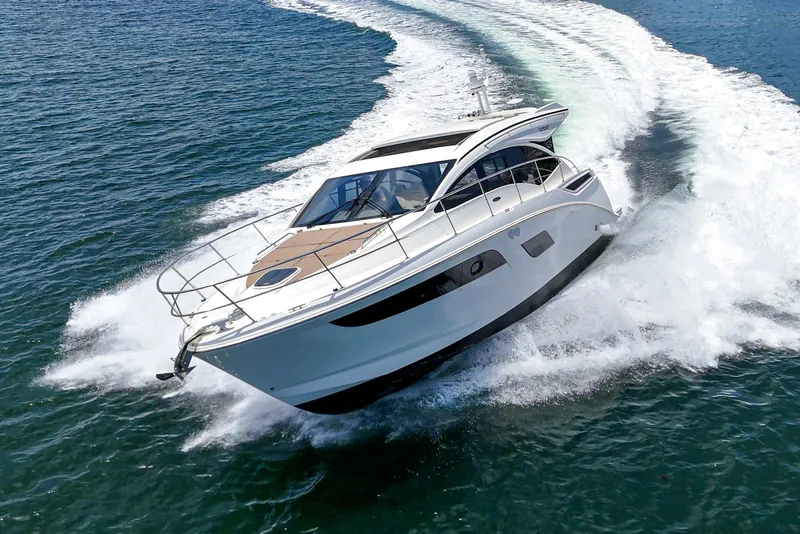 Slide: The Image of 2017 Sea Ray Sundancer 400 cruising on open water, creating a dynamic wake. - 9