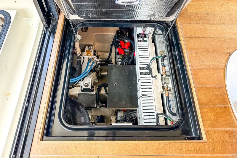 Slide: The Image of Engine compartment of a 2017 Sea Ray Sundancer 400 yacht, showcasing mechanical components. - 37
